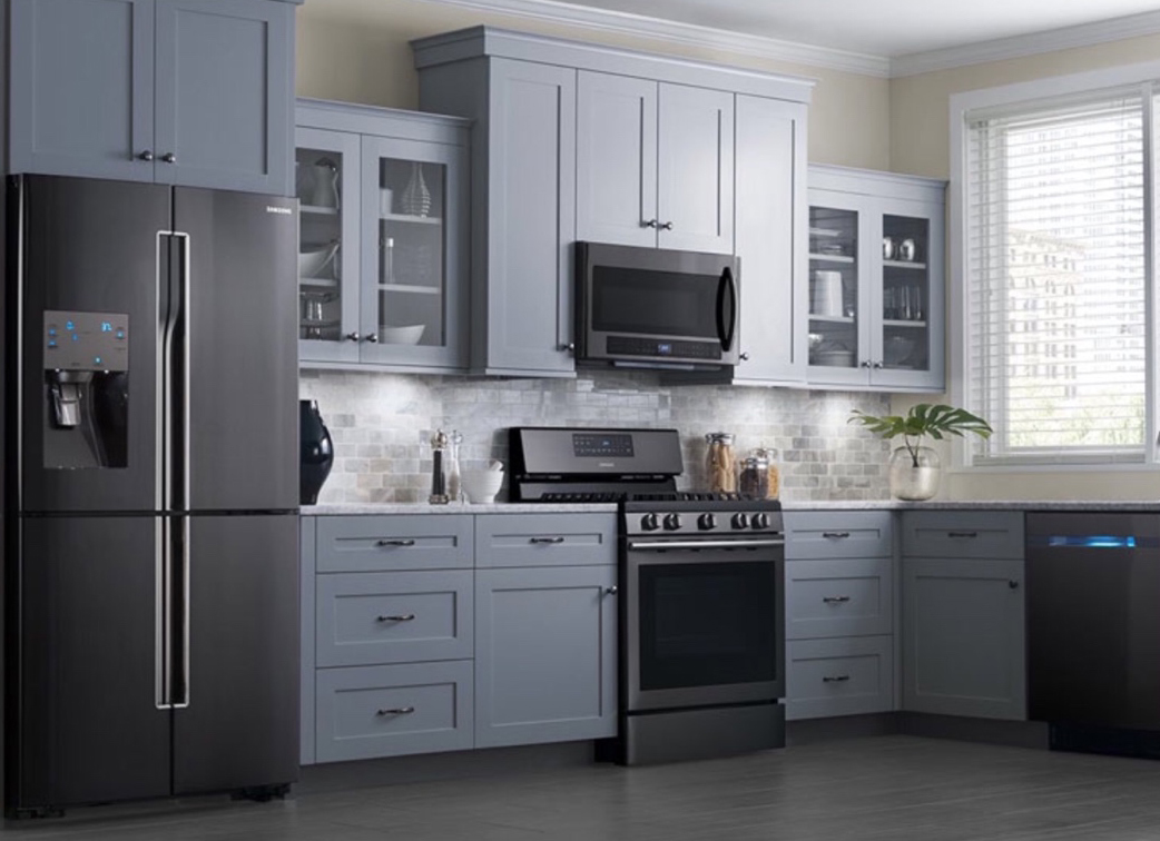 Modern gray kitchen with stainless appliances and a new sink
