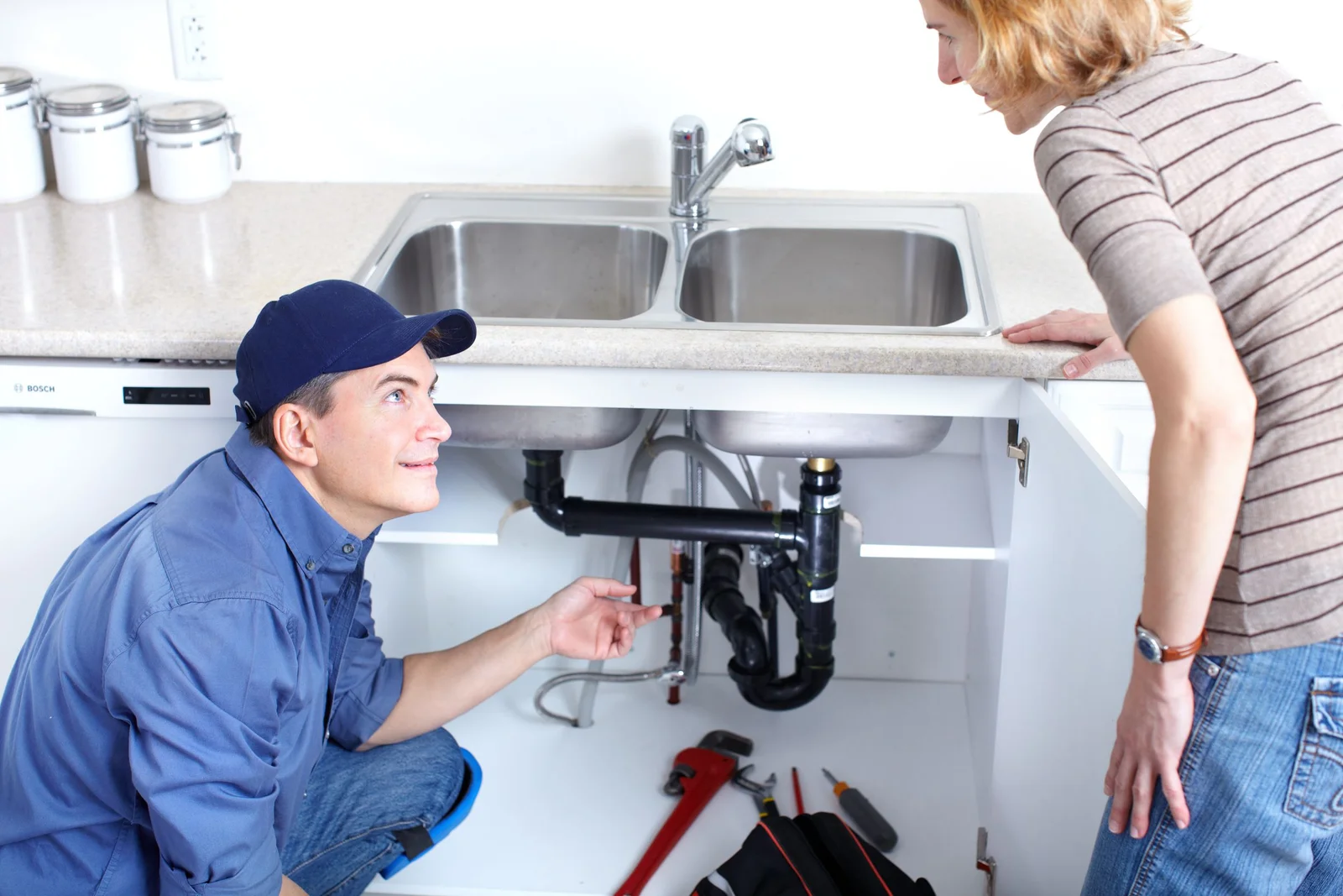 Plumber explaining repair to customer